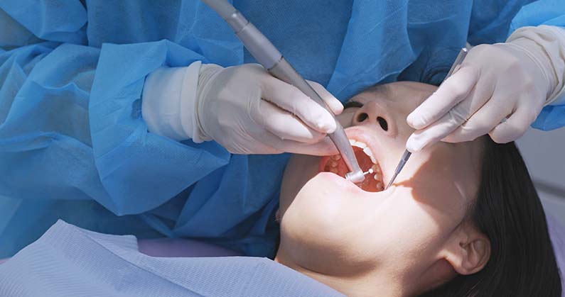 Woman undergo dental check up