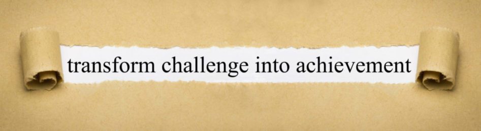 Parchment paper with the phrase, transform challenge into achievement